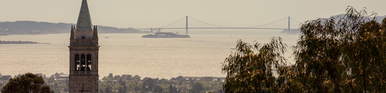 Photo of the campanile, with the SF Bay and the Golden Gate Bridge in the background.